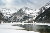 Beautiful landscape of a lake in snowy Alpen mountains