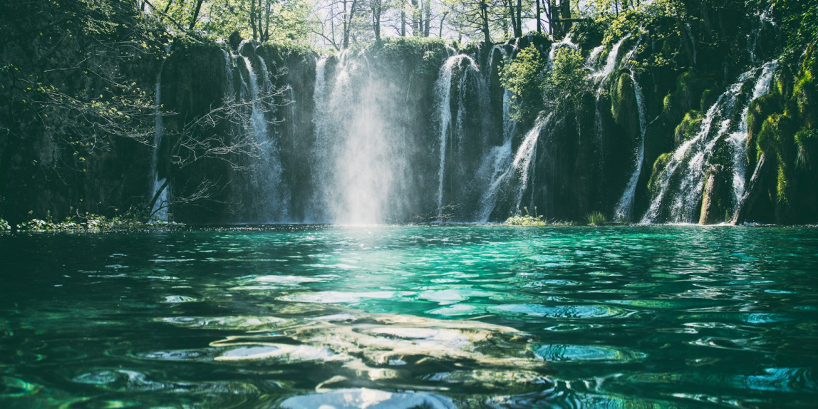 time-lapse photography of flowing multi-tier waterfall