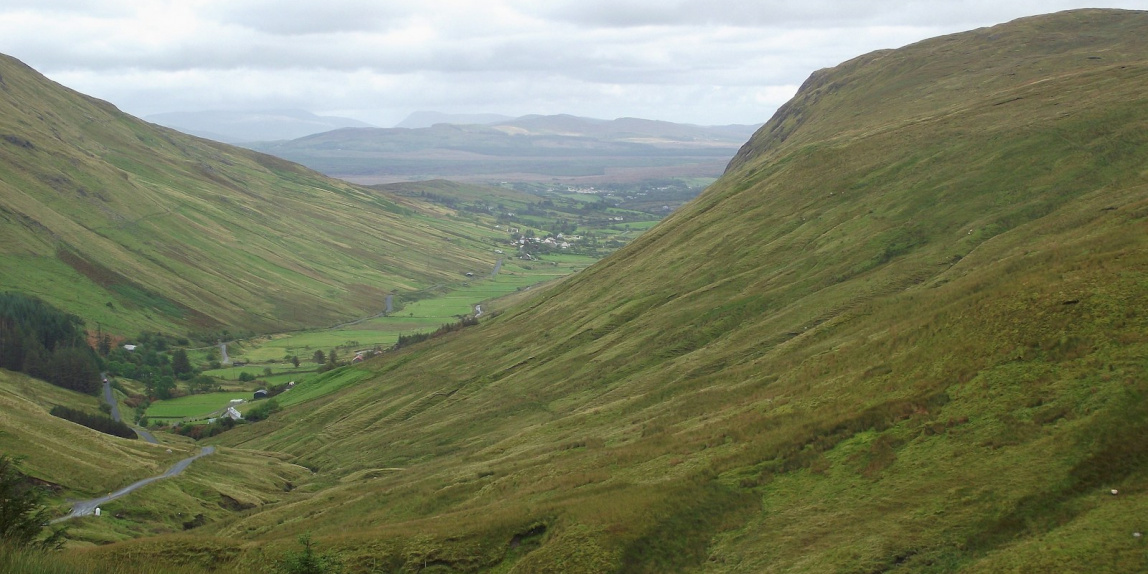 green mountains under white clouds during daytime