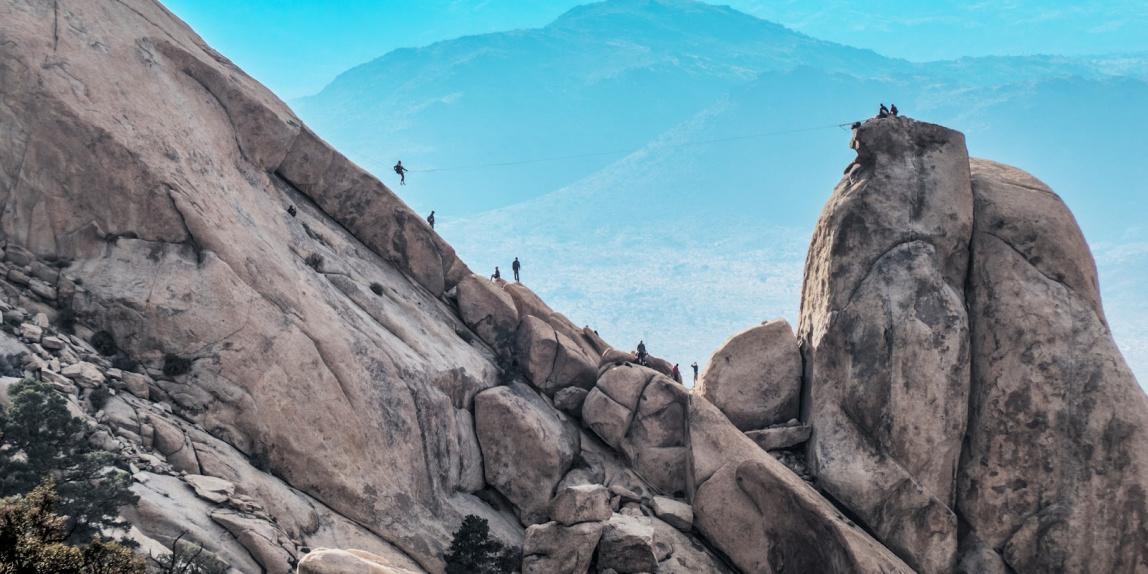 people climbing on mountain