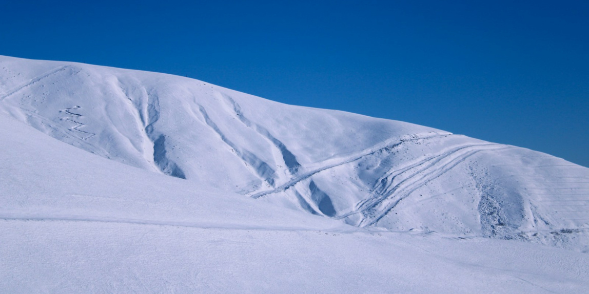 snow covered mountain under blue sky during daytime