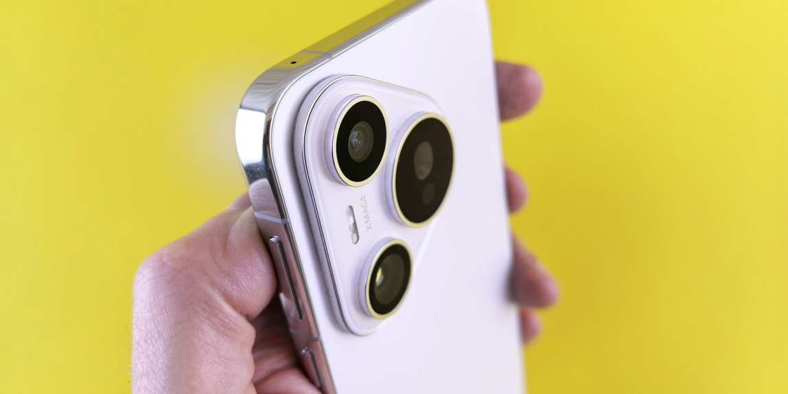 A person holding a cell phone in their hand