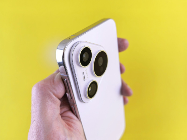 A person holding a cell phone in their hand