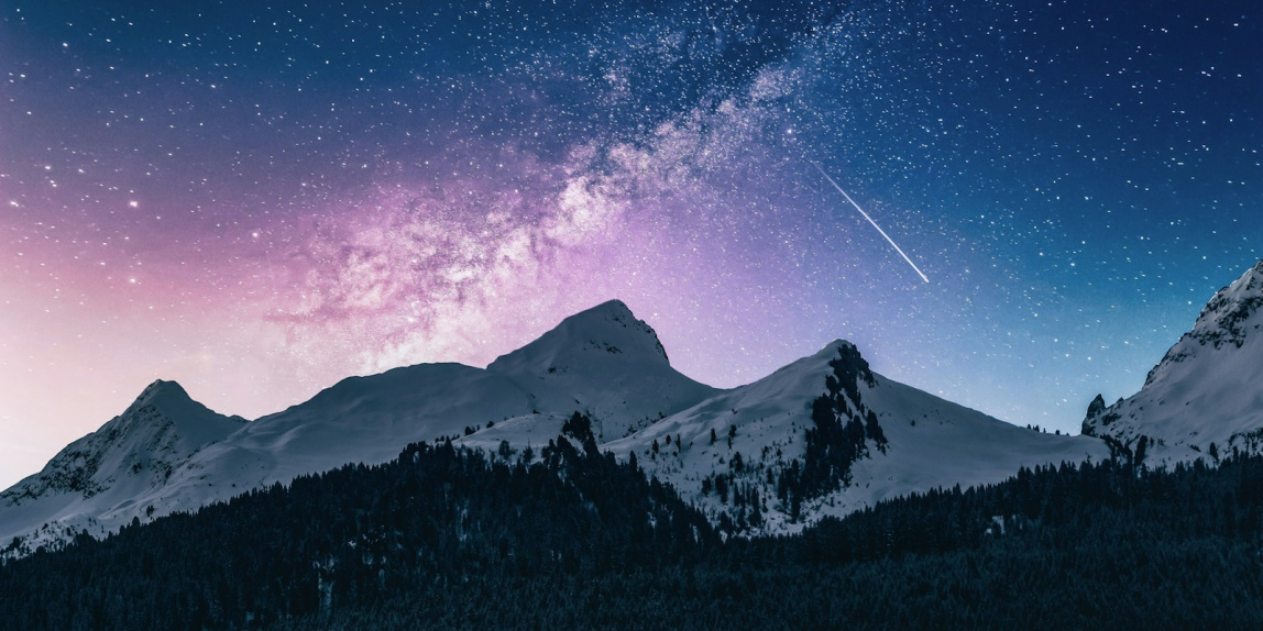 snow mountain under stars
